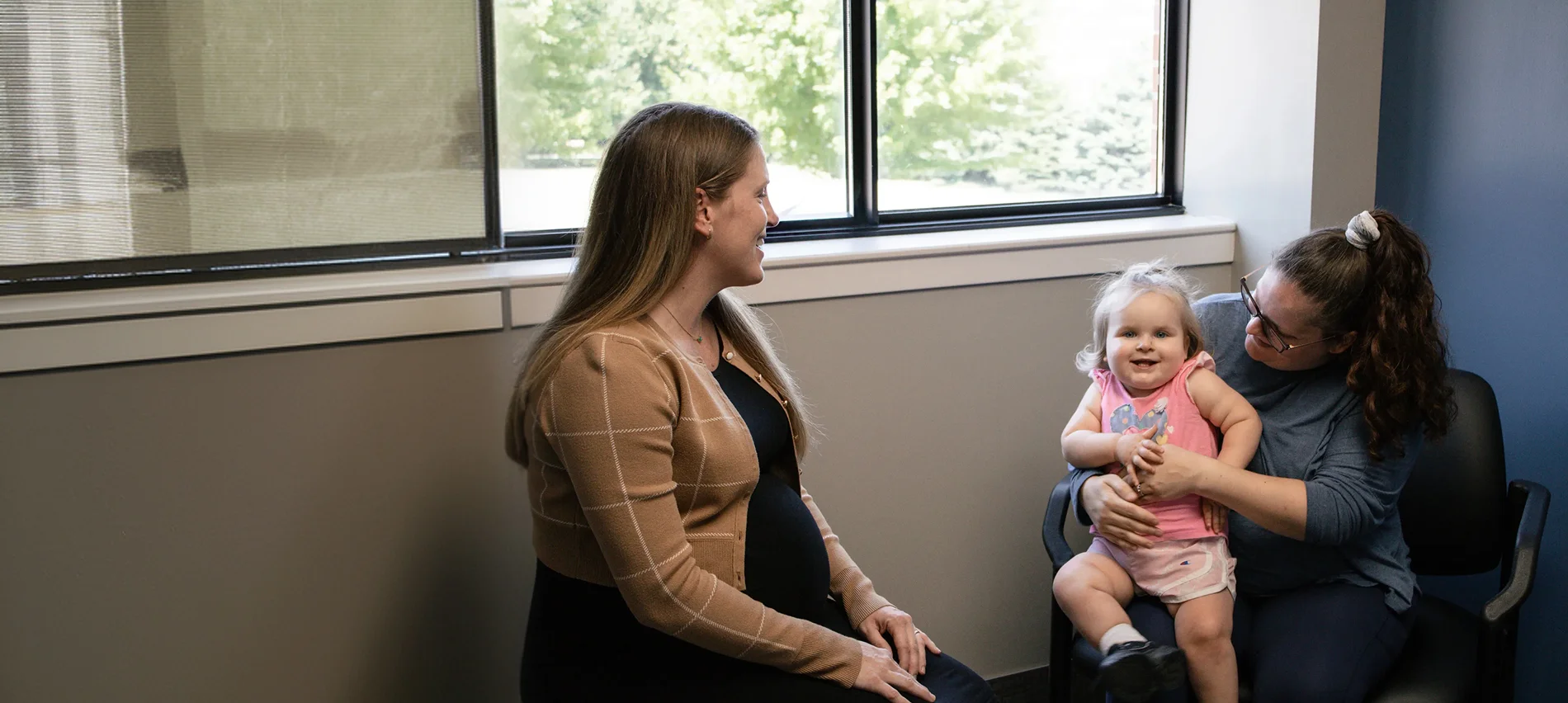 Memorial Community Hospital primary care patient sitting in an exam room for a primary care appointment